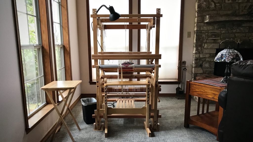 Sweet little hand-made loom.