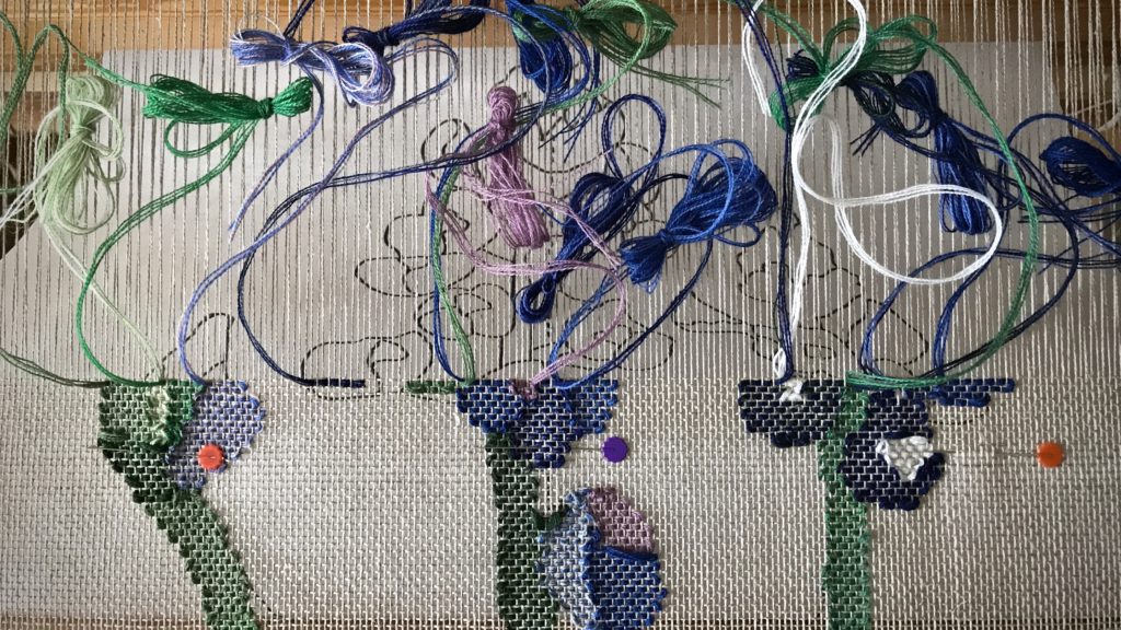 Weaving Texas bluebonnets in a transparency.