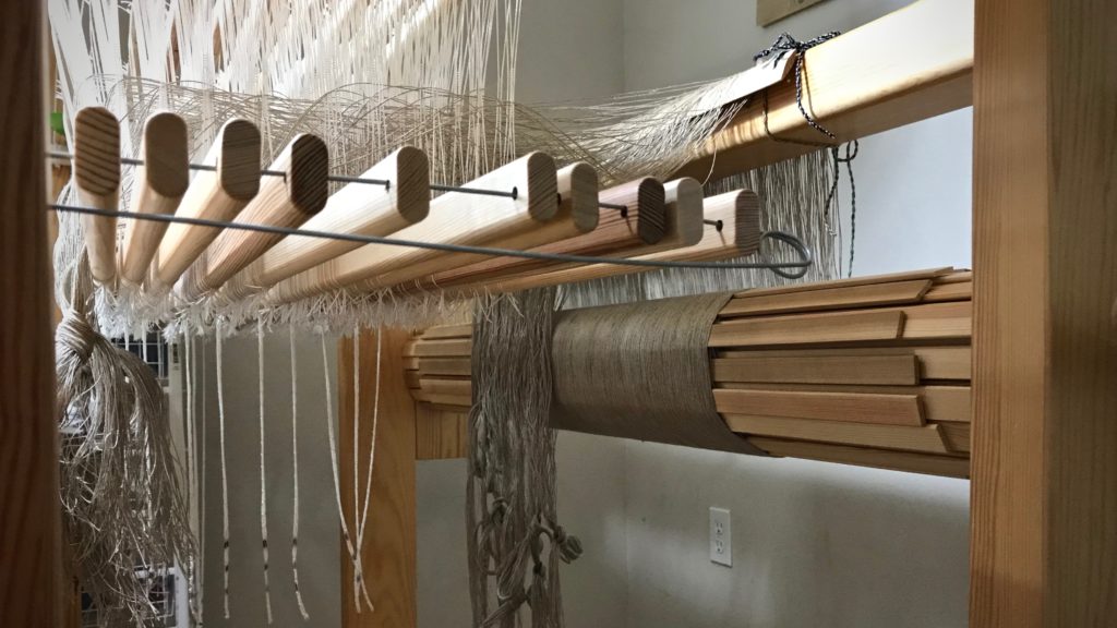 Threading linen on ten shafts.