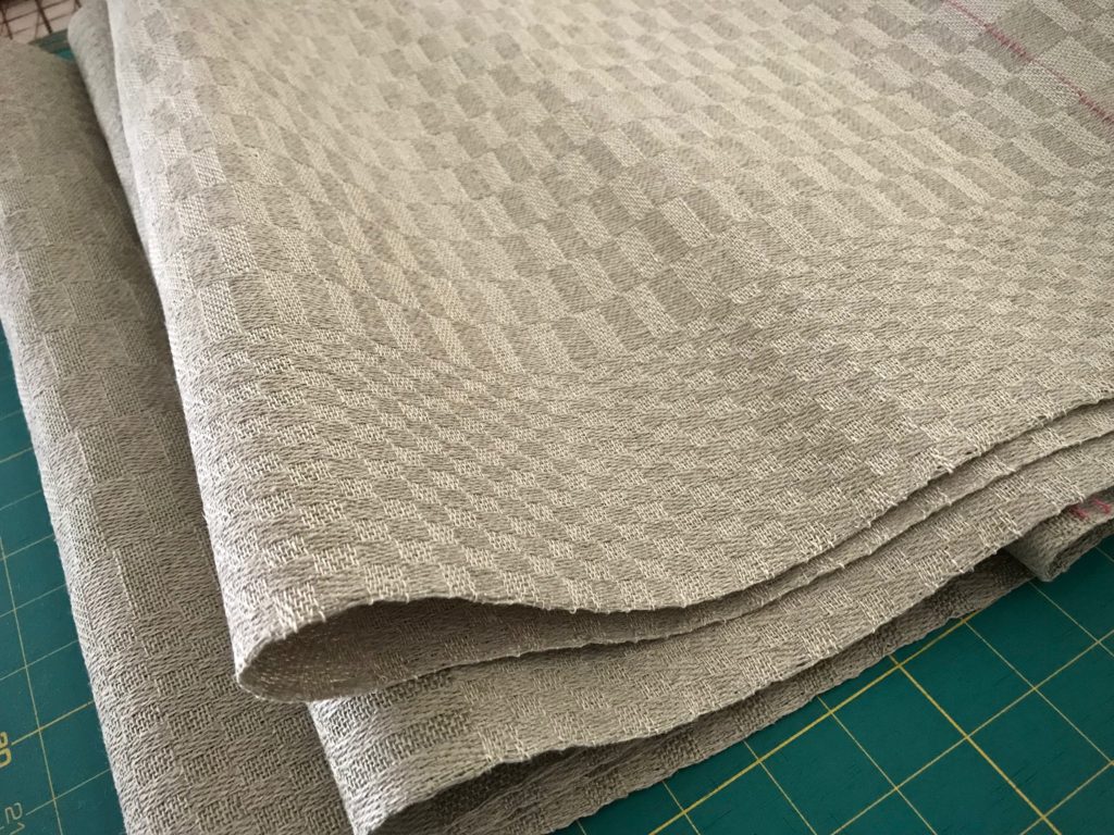 Linen fabric just off the loom, ready for finishing.