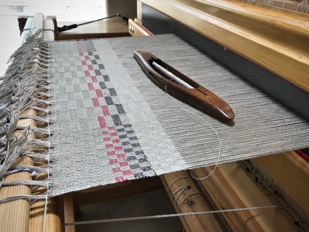 Sampling weft colors on a linen warp.