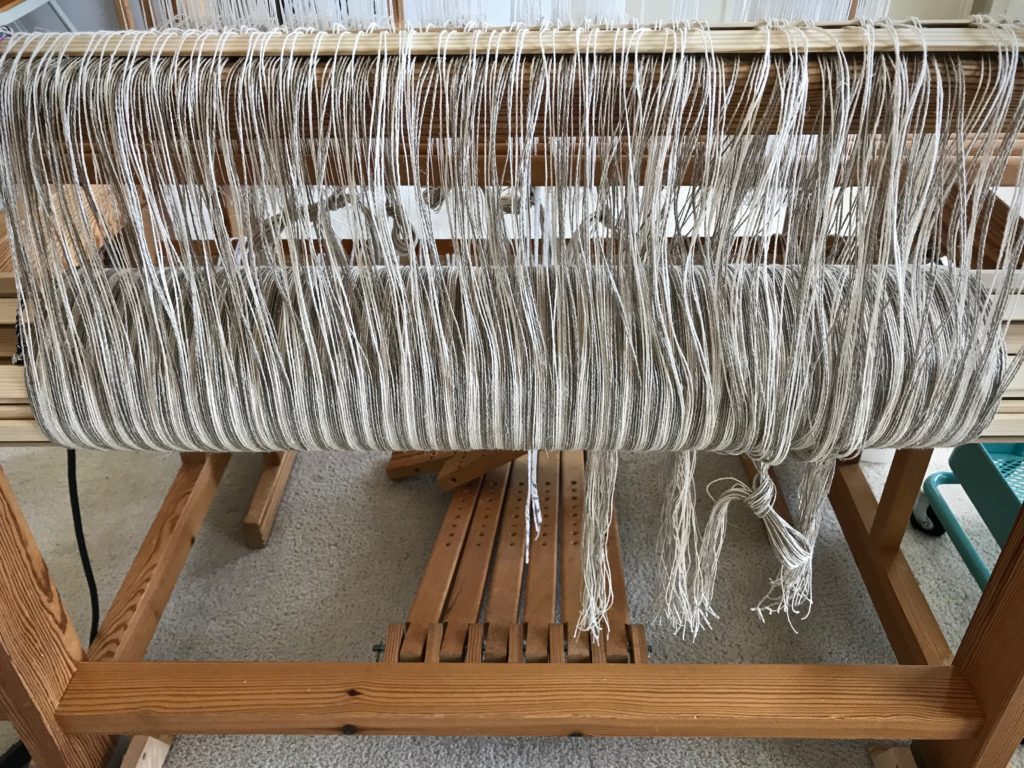 Stripes on the warp beam are so enticing! Linen.