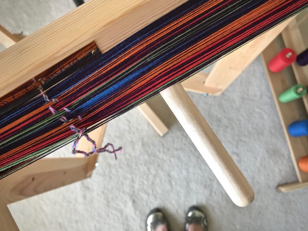 Winding a colorful warp.