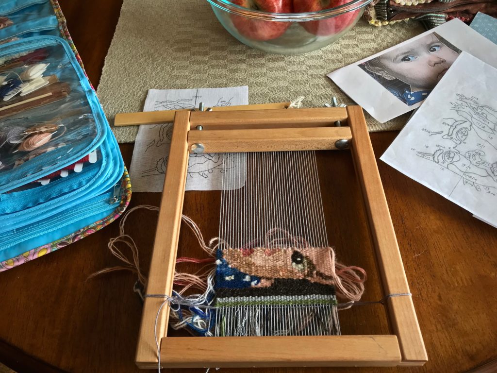 Travel tapestry in progress. My granddaughter.