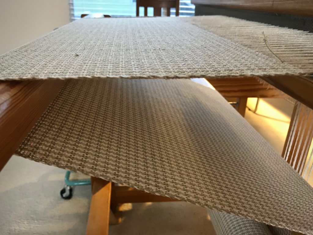 Linen upholstery fabric on the loom.