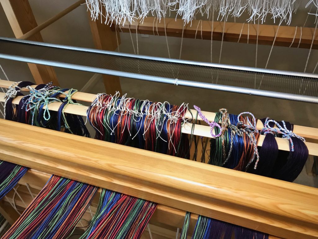 Delicate transfer of warp ends accomplished!