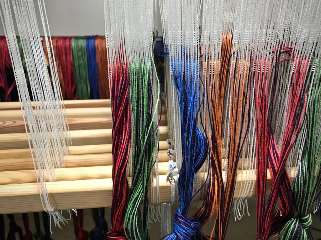 Threading heddles for double weave on a Glimakra Standard loom.