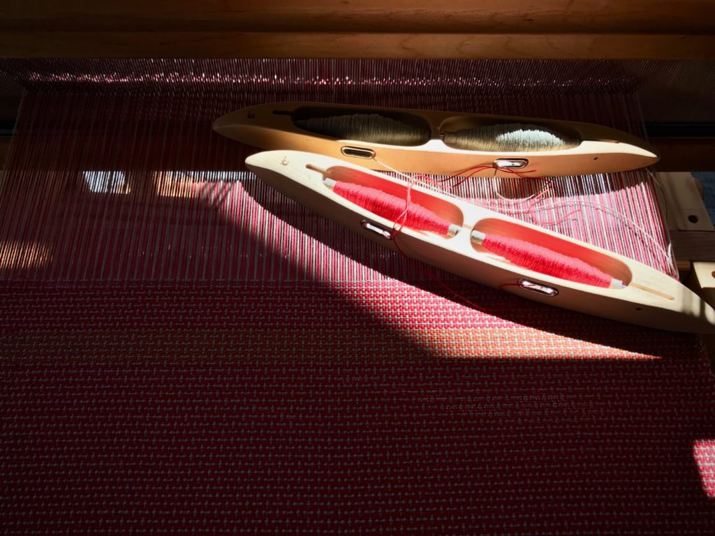 Cotton placemats on the loom with color and weave effects.