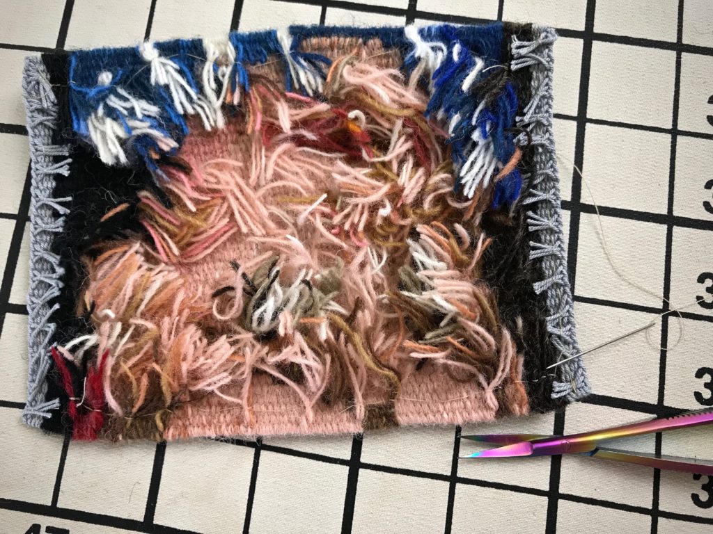 Finishing a small tapestry. Cute slideshow video.