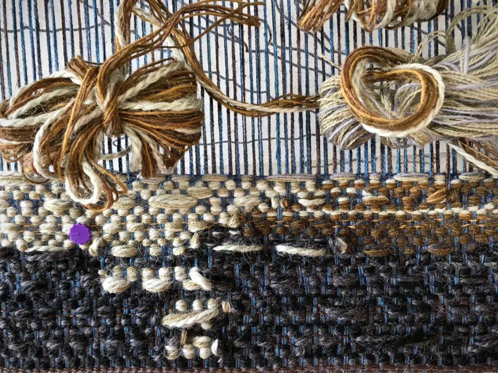 Blending yarn colors and thicknesses for tapestry.