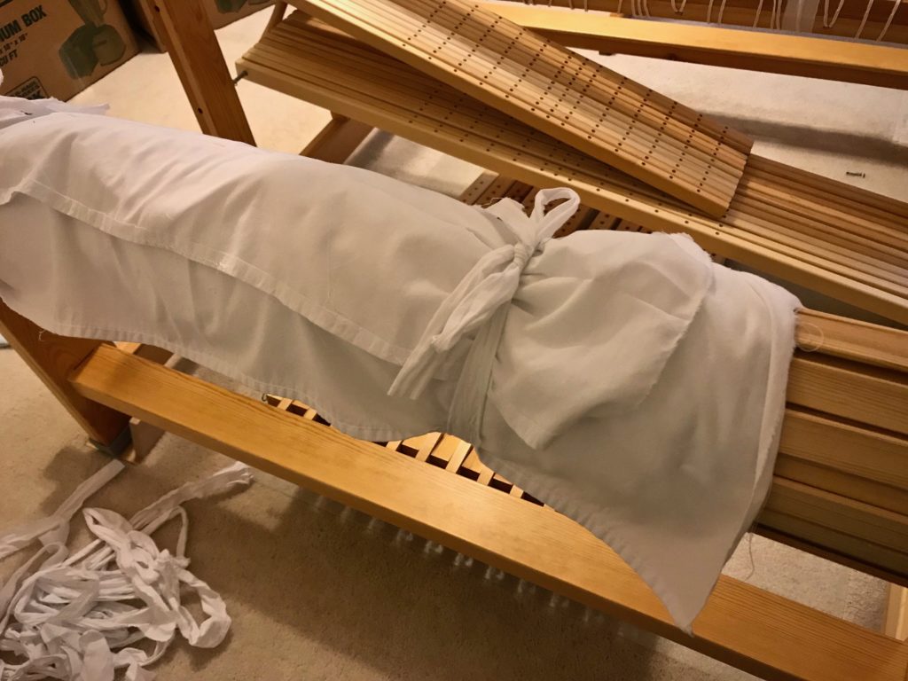 Preparing loom for dismantling with warp on the loom.