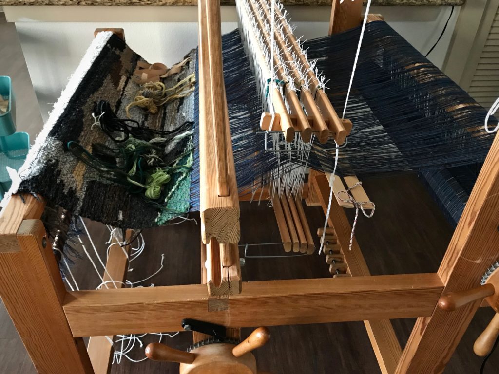 Re-assembling loom after relocating.