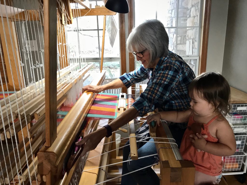 Helper for managing the shuttles at the loom. :)