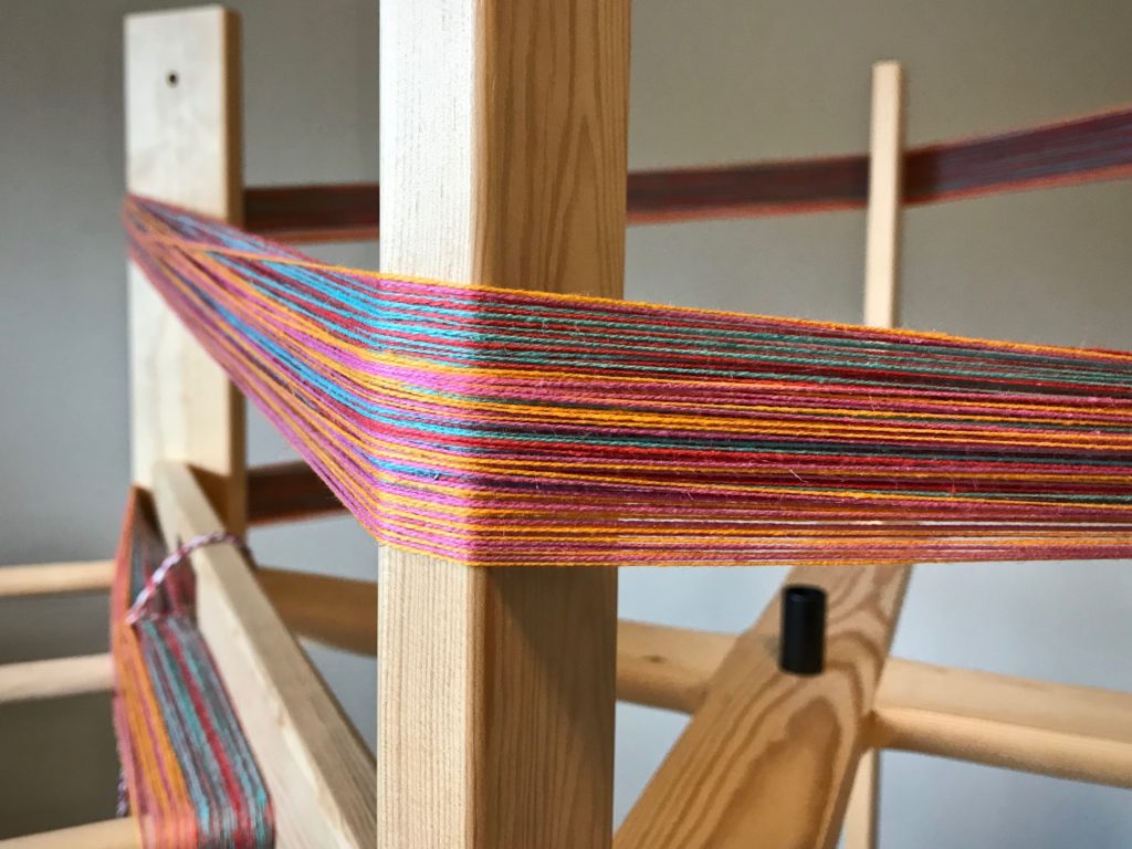 Winding a warp for double weave towels.