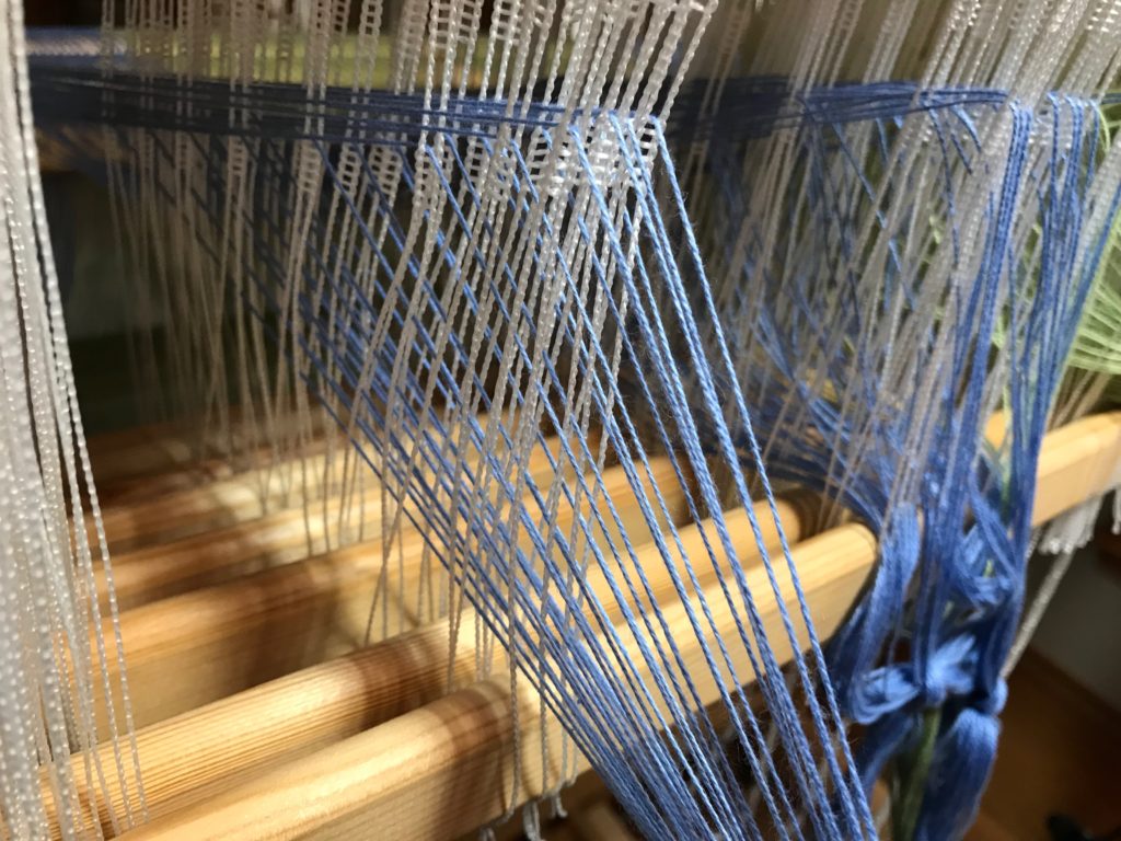 Threading eight shafts.