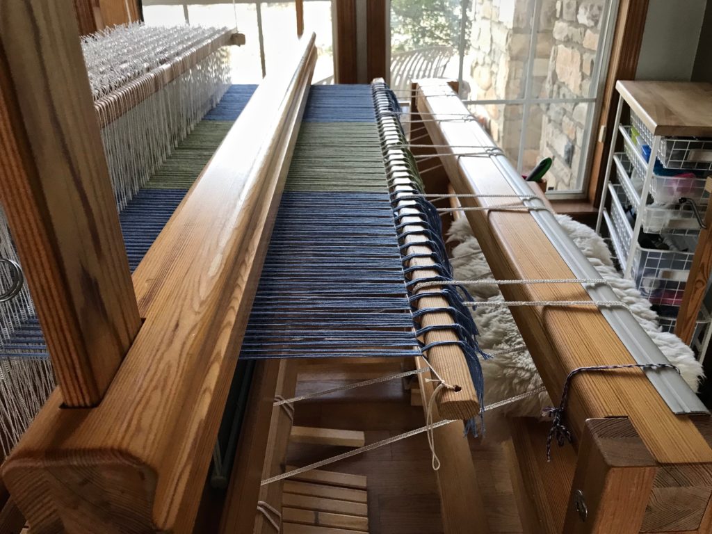 Leveling string flattens and evens out the warp for no-waste weaving.
