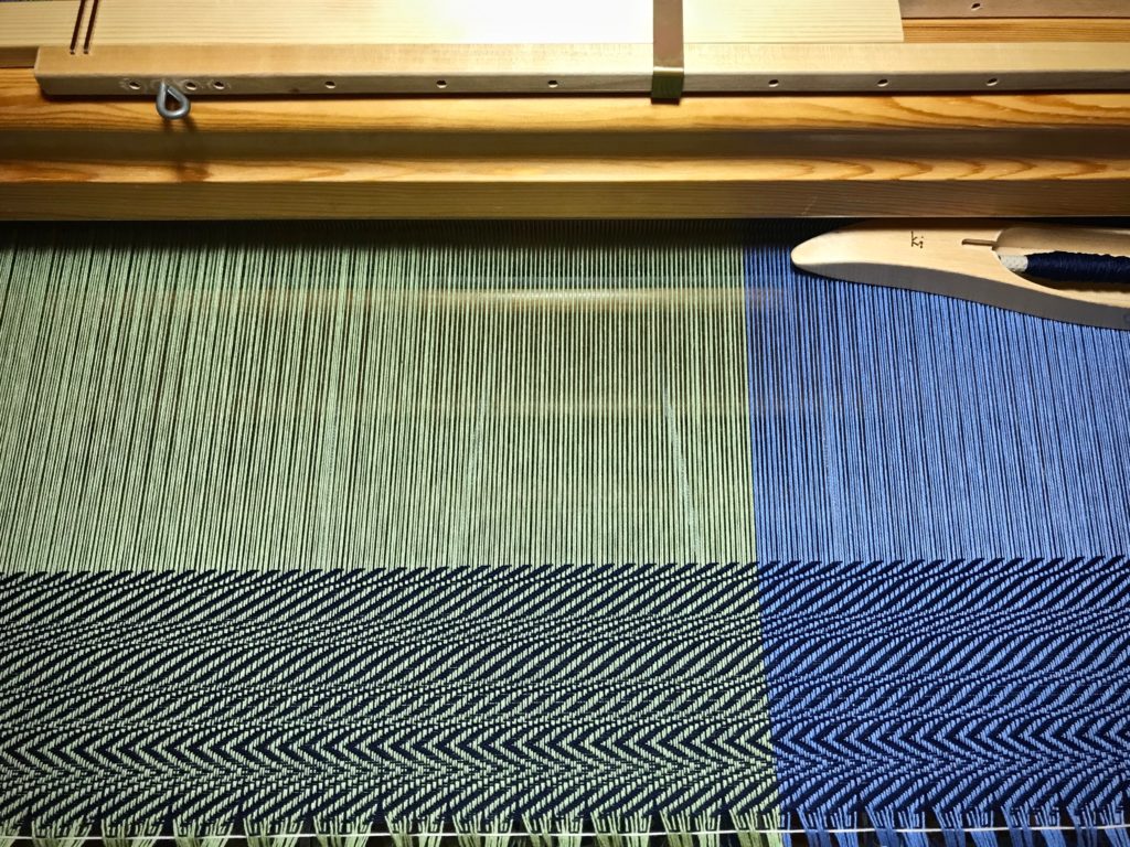 Sampling before weaving a cotton throw.