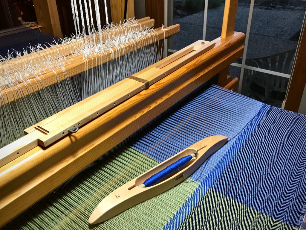 Testing weft colors for undulating twill cotton throw.