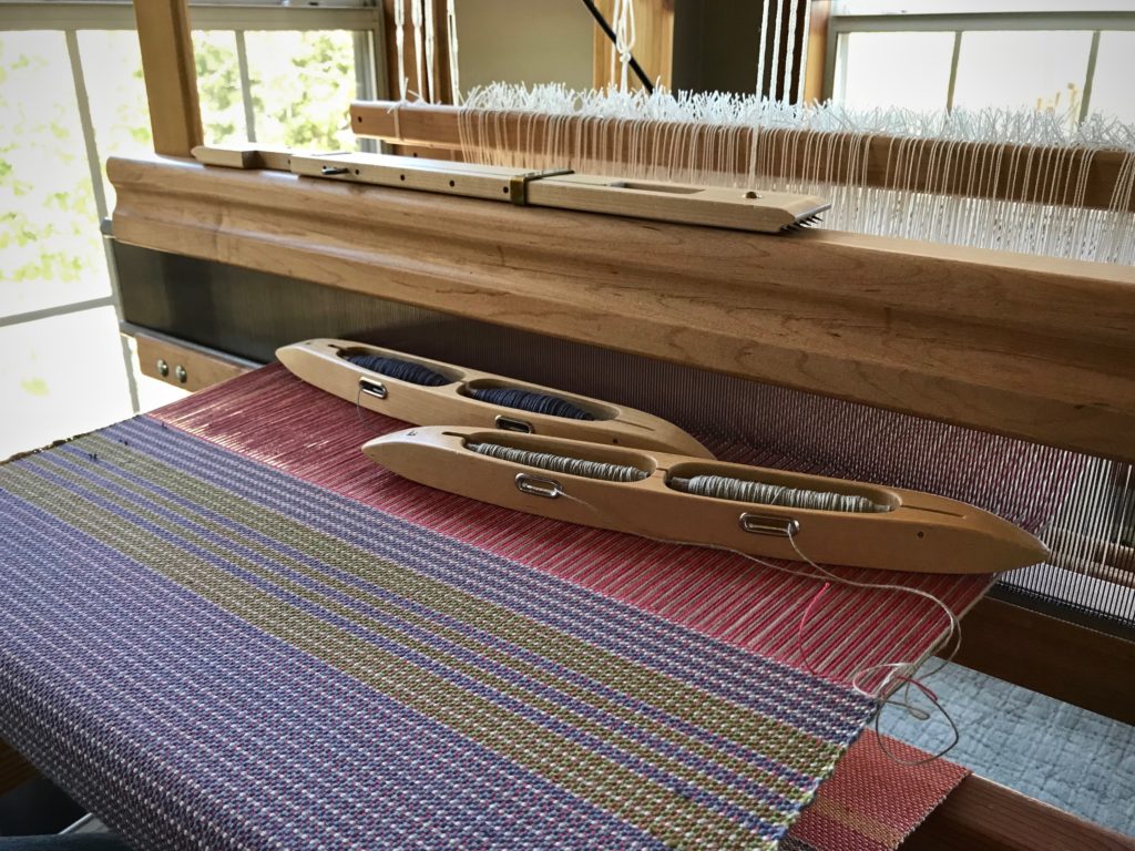 Weaving placemats in a sunny corner.