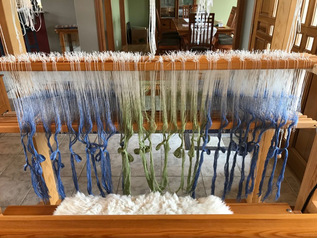 Heddles are threaded.