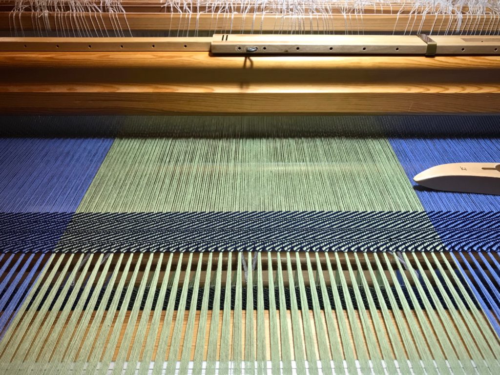 Hemstitching at the beginning of the cotton throw.