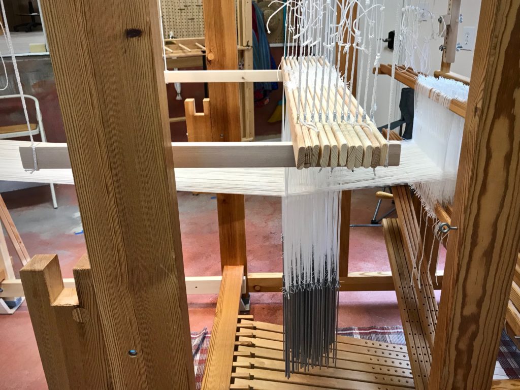 Drawloom with ten pattern shafts, plus one extra shaft.