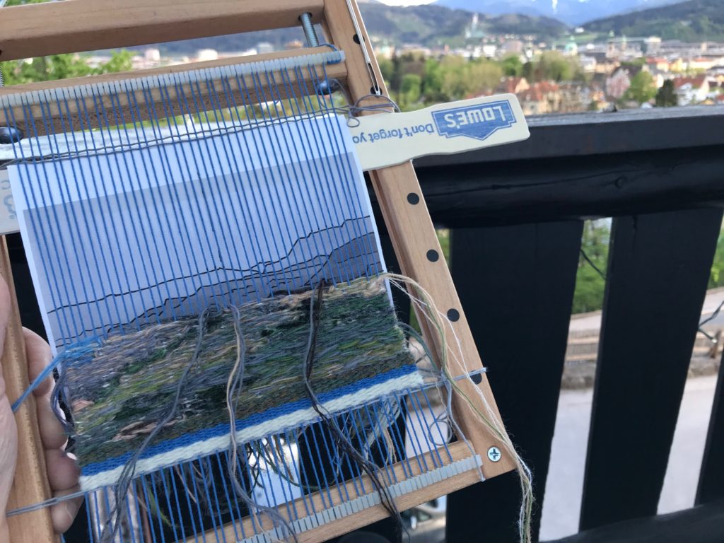 Weaving an image from Big Bend State Park, Texas, while enjoying the balcony view in Innsbruck, Austria.