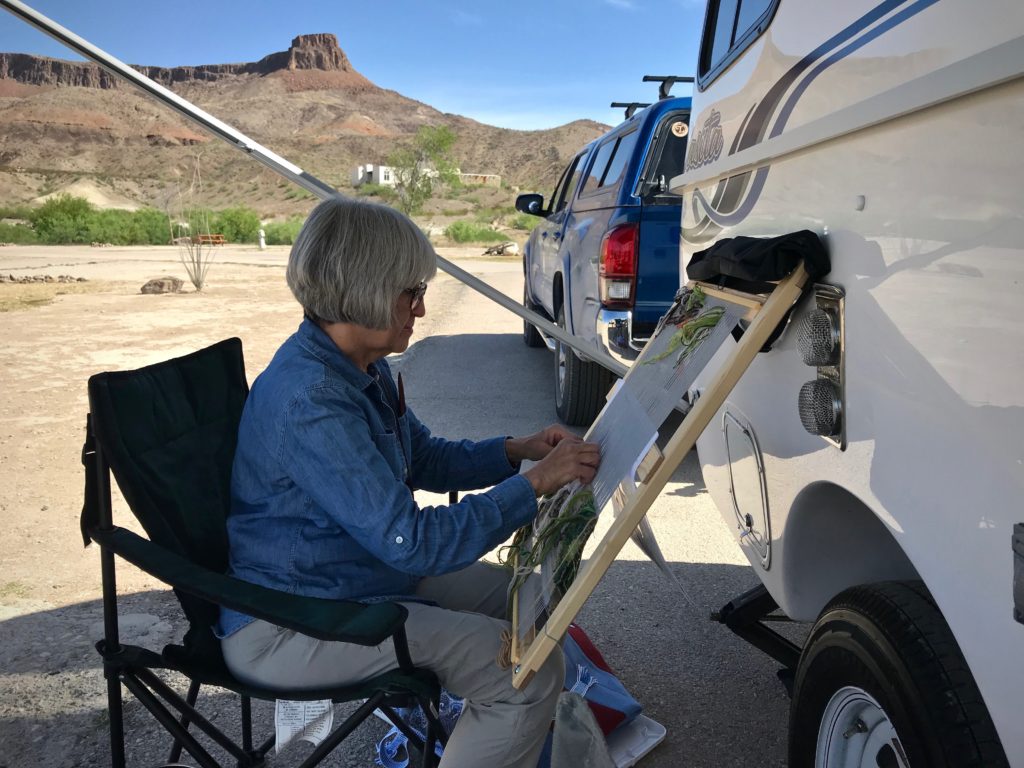 En plein air tapestry weaving by the Casita travel trailer.