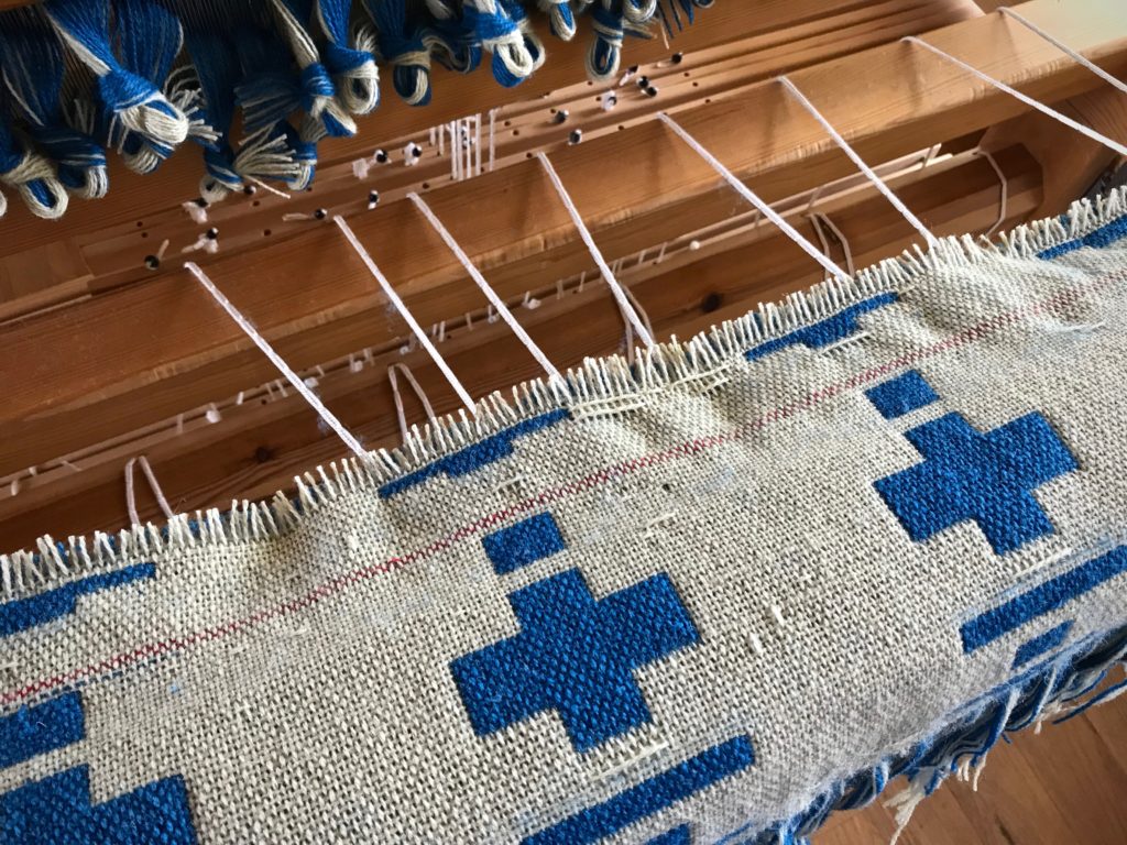 Cutting off a failed double weave project. Ugh.
