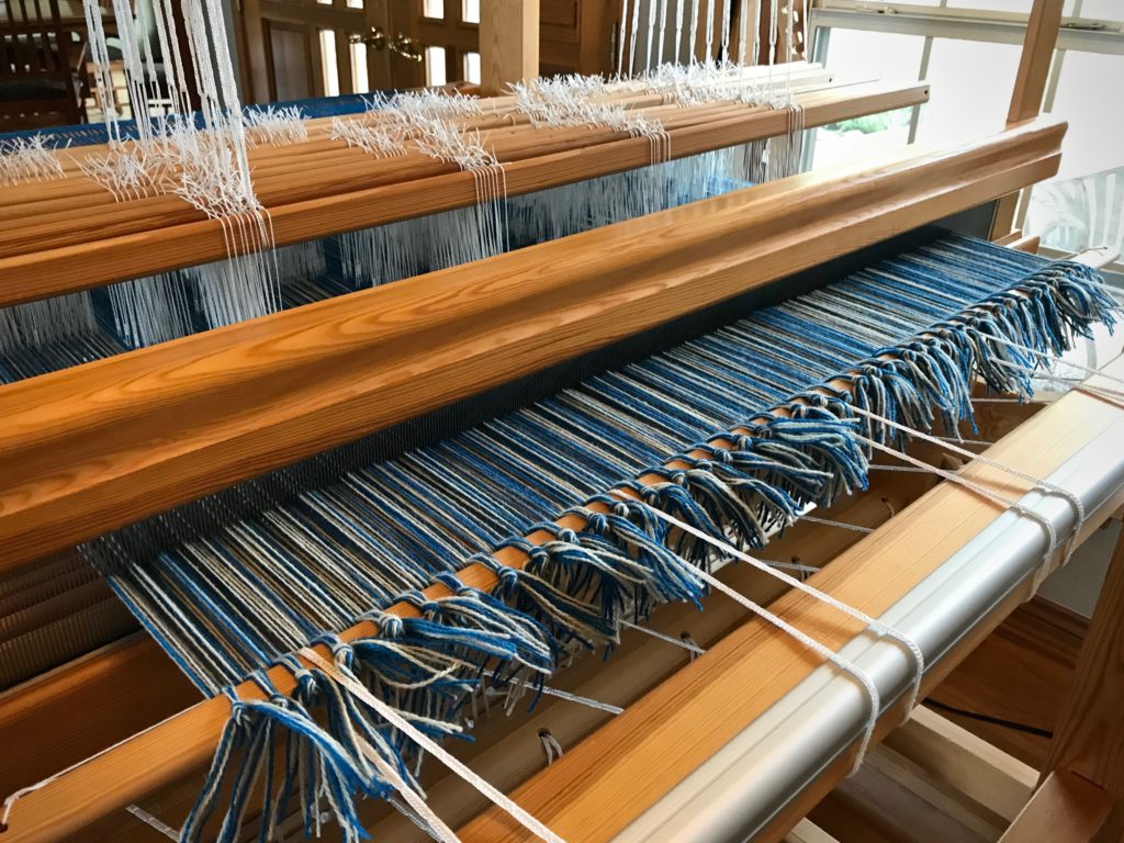 Wool warp for a double weave blanket.