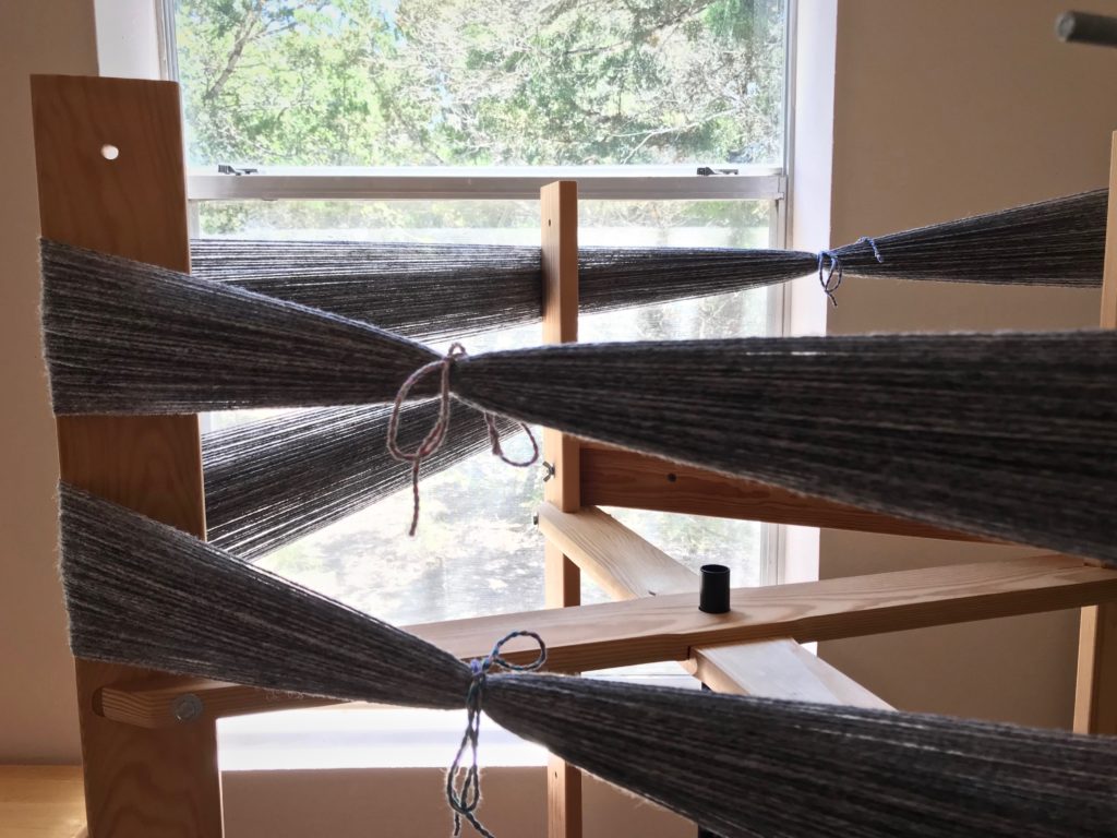 Winding warp on the warping reel.