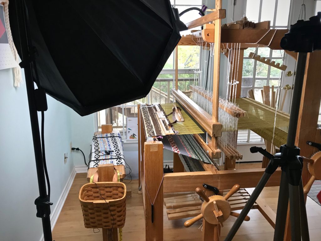 Filming a short video on weaving rag rug selvedges.