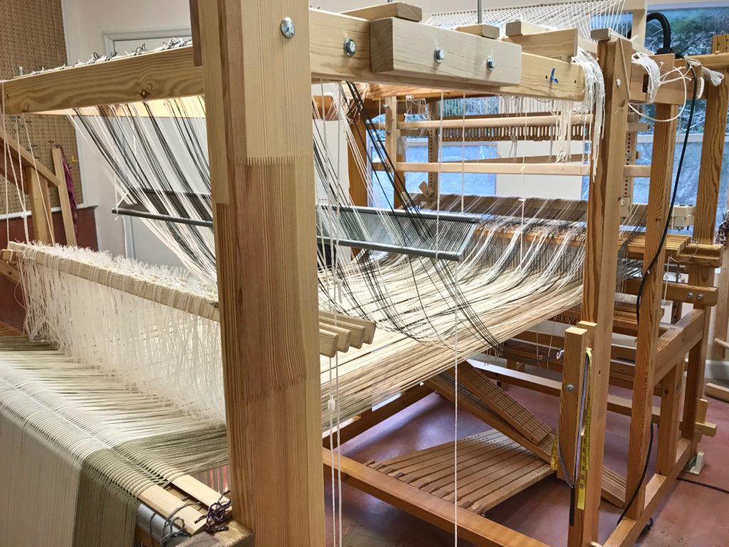 Setting up single-unit draw cords on the drawloom.