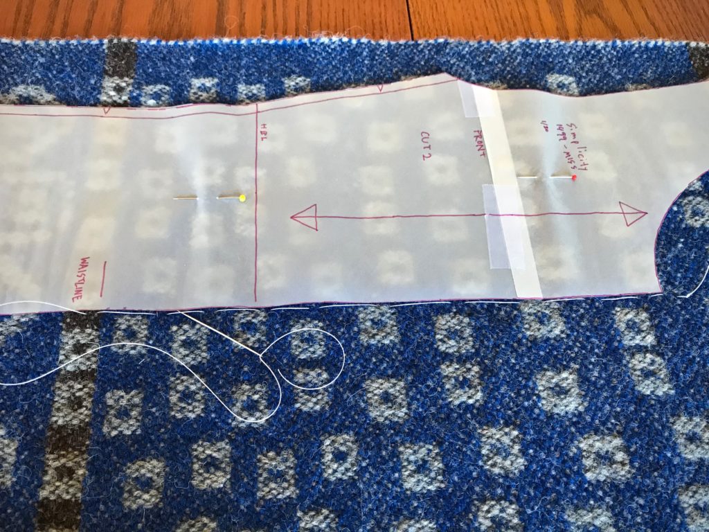 Cutting lines marked with basting stitches.