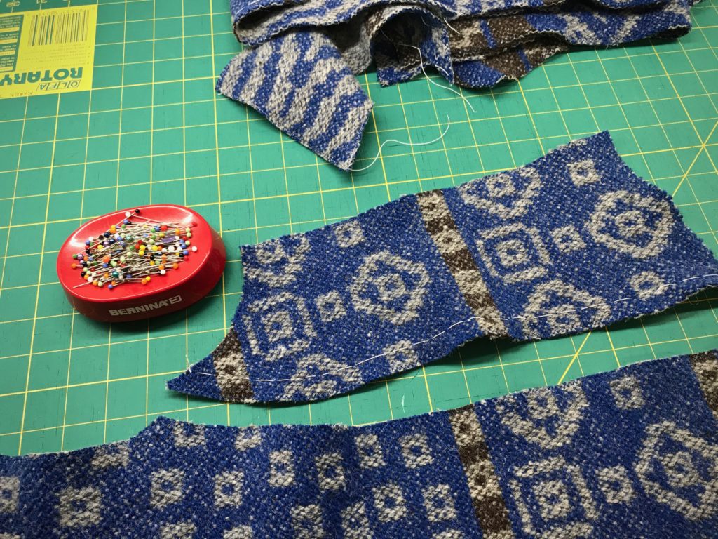 Sewing a handwoven garment.