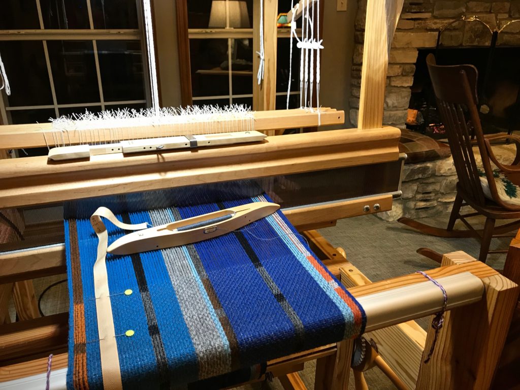 Weaving by the fire in the middle of winter.