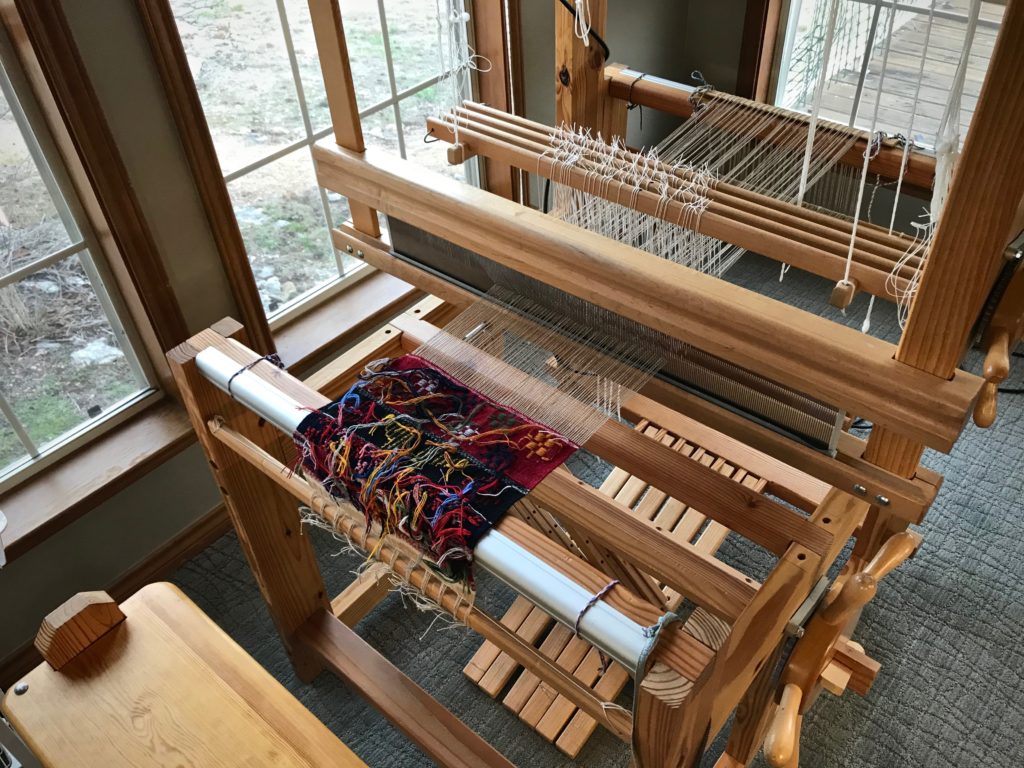 Weaving Swedish art weaves from the back.