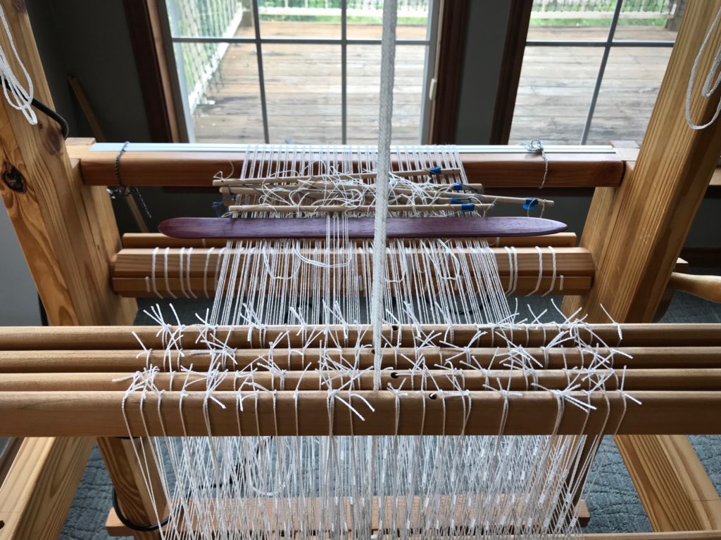 Weaving Monksbelt with half heddle sticks.