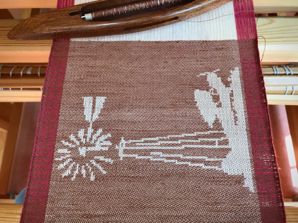 Windmill and taildragger woven on the drawloom.