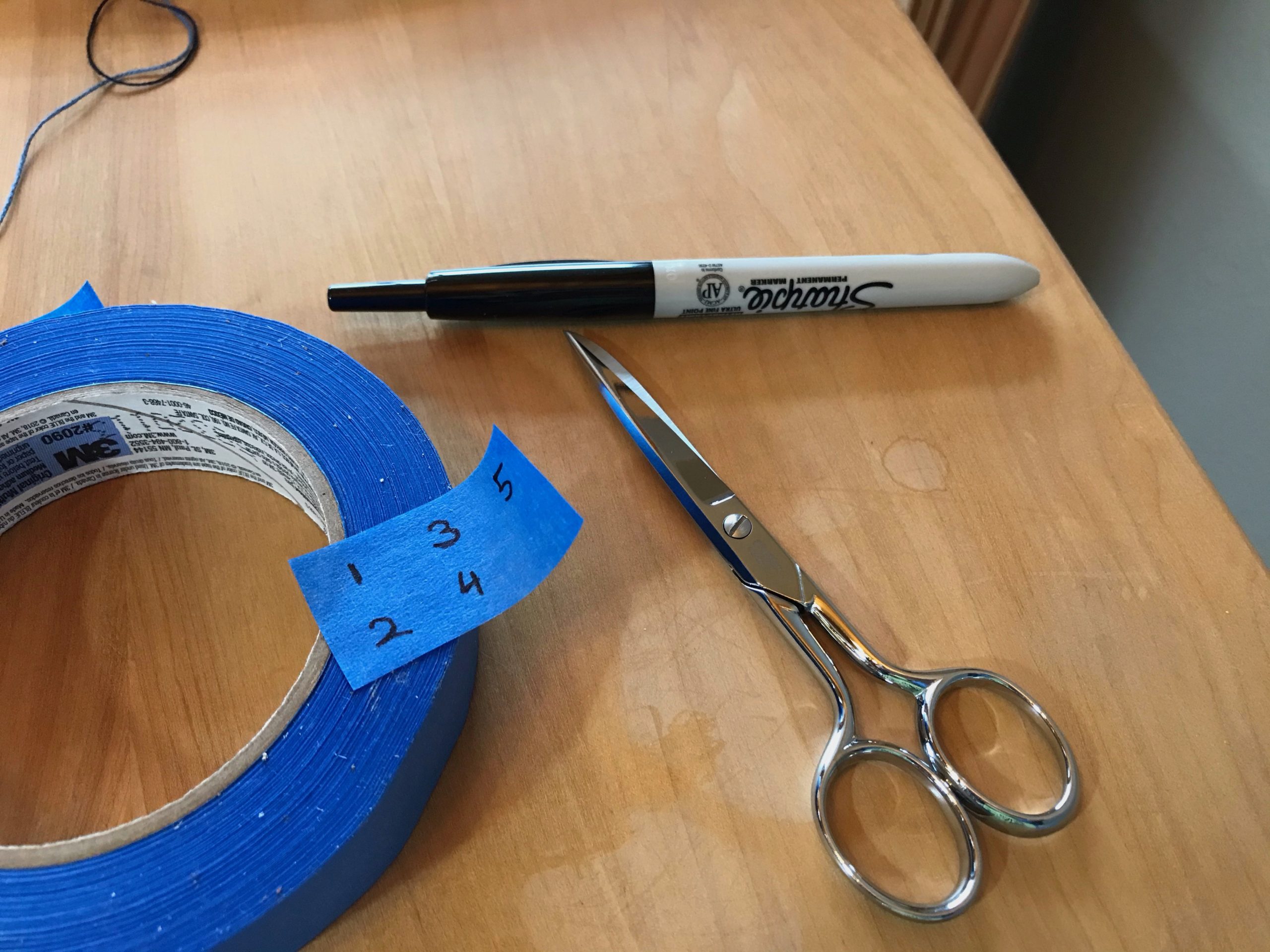 Make removable labels with blue painter's tape.