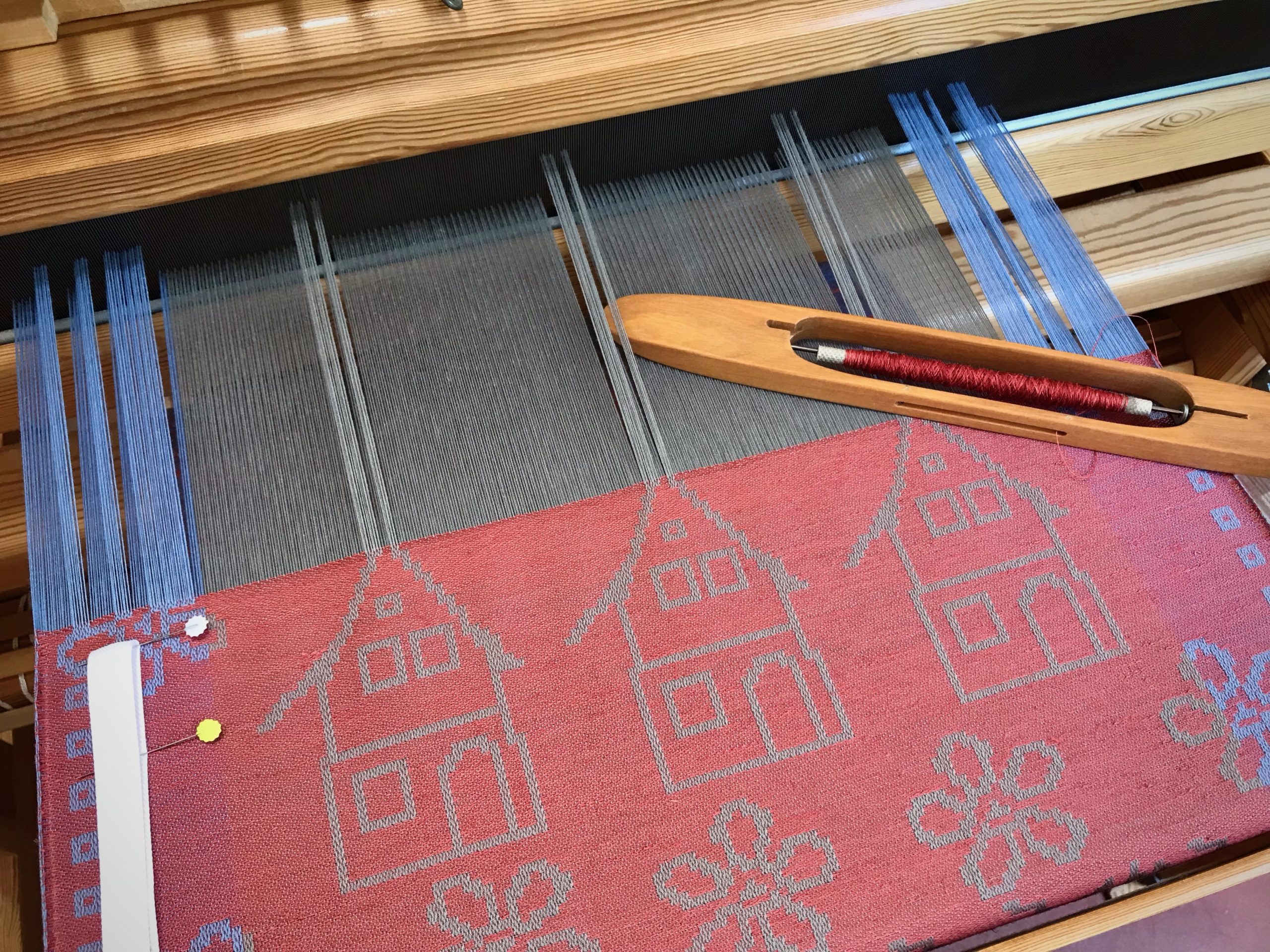 Weaving personalized towels on the drawloom.